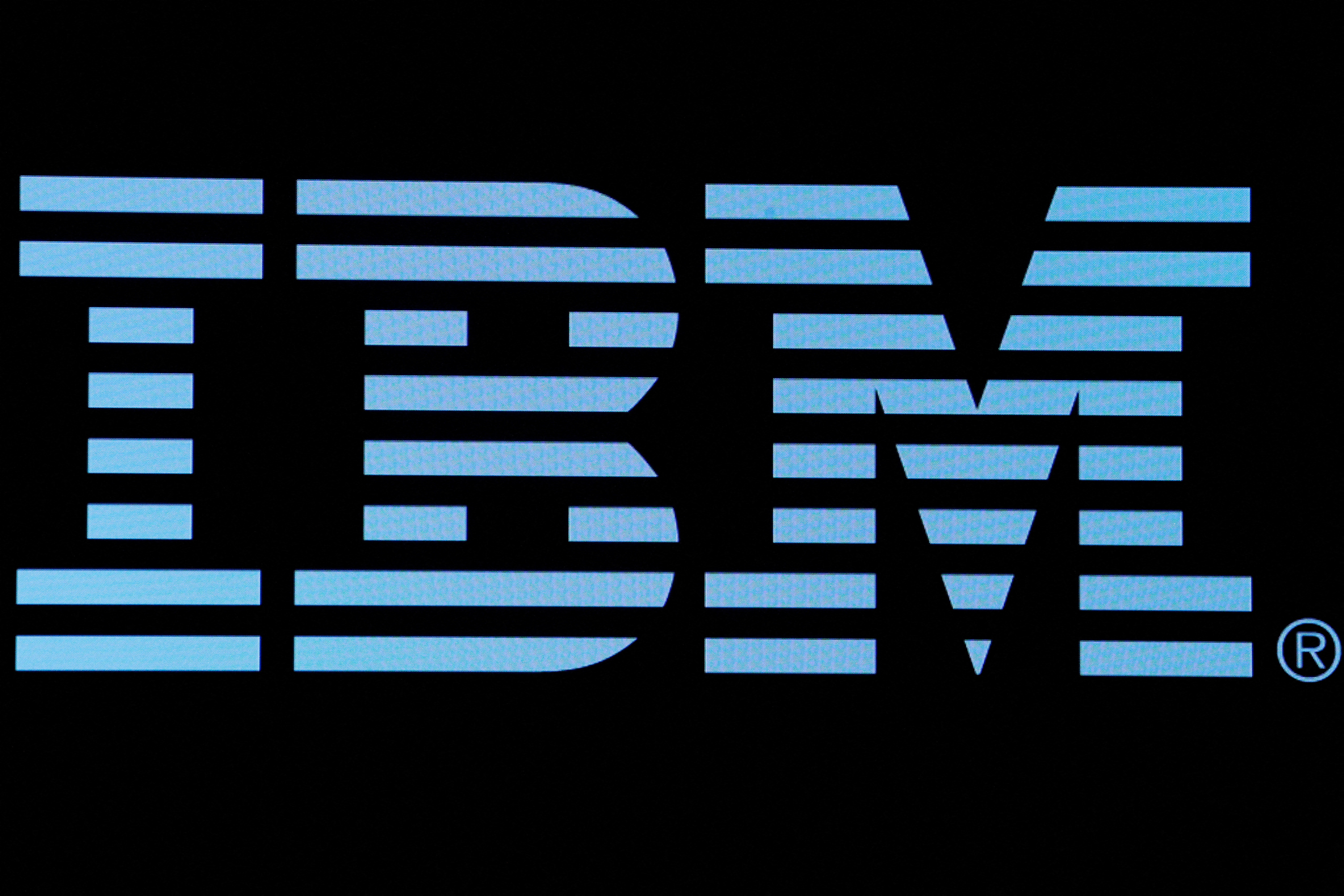 The logo for IBM is displayed on a screen on the floor of the NYSE in New York