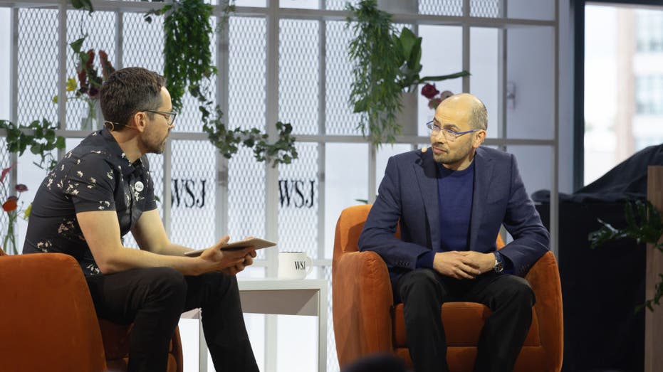 Photo of Chris Mims and Demis Hassabis